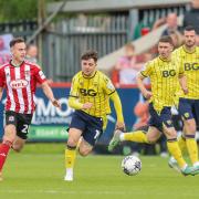 Tyler Goodrham chases for the ball against Exeter City