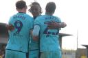Mark Harris, Greg Leigh and Josh Murphy celebrate the latter’s goal against Burton Albion