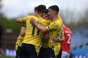 Oxford United players celebrate against Fleetwood Town