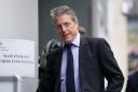 Hugh Grant has settled his High Court claim, a judge was told (James Manning/PA)