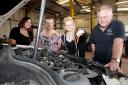 Phil Scott of Carterton Auto Repair who is offering basic maintenance course for women, such as checking the oil levels and tyre pressures. They are also offering manicures with MOTs. Pictured are (l-r) Holly Smith from Simply Beauty who will be doing the