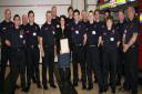 Trudy Boyle, centre, with son Jed on her left, and Watch Manager Darran Gough on her right, with Banbury’s retained firefighters