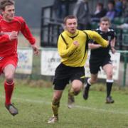 North Leigh’s Matty Taylor (right) makes a break with Abingdon defender Jeff Brown in hot pursuit