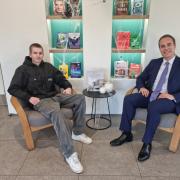 CAMPAIGN: Ed Neighbour who carried out work experience at Hachette UK Distribution with MP David Johnston
