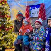 PALS member, Jenny Cole and her two children waiting to meet Santa in the Grotto at Ladygrove Primary School