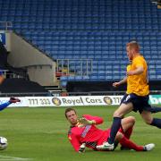 Deane Smalley slides the ball past goalkeeper Colin Doyle to finish off a spectacular solo effort