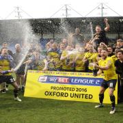 Oxford United celebrate promotion on the pitch  Picture: David Fleming