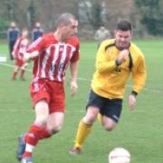 Drayton's Adam Gordon (right) keeps a close eye on Lambourn's Kevin Hammerston during Saturday's top clash in Divisison 1