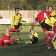 North Leigh’s Andy McCabe(right) causes havoc in the Cinderford goalmouth following a corner