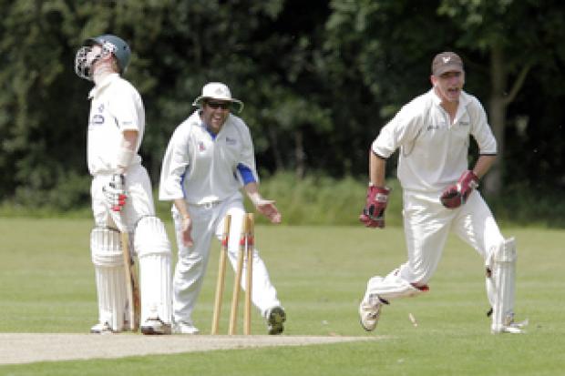 Nondies keeper Jon Guthrie (right) leads the celebration after Hanborough batsman Aston Leach is bowled out in their Division 2 clash