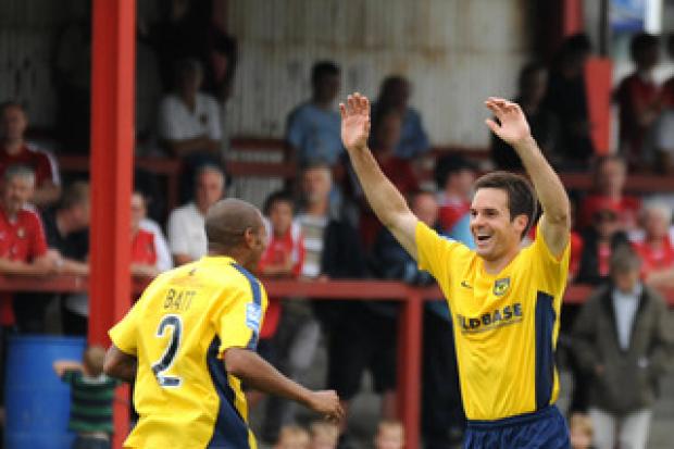 Simon Clist acknowledges his stunning volley during Oxford United’s win at Ebbsfleet on Saturday, as teammate Damian Batt races to join in the celebrations