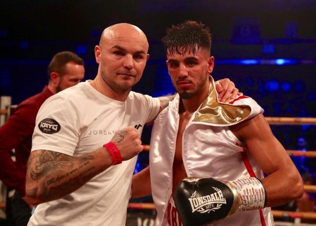 Jordan Flynn with trainer Kevin Mitchell Picture: Unknown Boxers