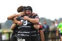 Josh Hodson (19) celebrates with Lewis Jones after scoring Chinnor’s fifth try. Picture: David Howlett