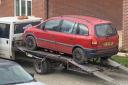 FINED: The car with the waste being towed before dumped into the brook