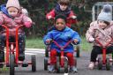 Kids from Marcham preschool having fun on the new road track created on the school site