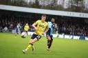 Will Goodwin chases the ball for Oxford United