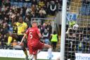 Greg Leigh heads in the winner for Oxford United