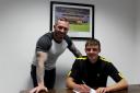George Jeacock signs a professional deal at Oxford United as head coach Michael Appleton looks on Picture: Sarah Gooding