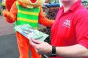 Leaflets ban . . . Play centre owner Mike Foster with mascot Chipper the squirrel