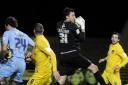 Oxford United keeper Max Crocombe collects a high ball safely