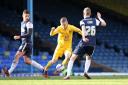 United's Alfie Potter skips through Southend's Michael Timlin (left) and Marc Laird during a first-half run