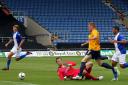 Deane Smalley slides the ball past goalkeeper Colin Doyle to finish off a spectacular solo effort