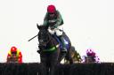 Loch Ba, ridden by Dominic Elsworth, leaps towards victory in the Betfred Goals Galore Handicap at Newbury in January