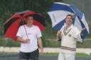 Kingston Bagpuize captain Dave Pearce (left) and his Oxford 2nd counterpart Ross Buchanan watch the rain fall before their match was called off