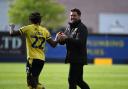 Des Buckingham celebrates with Greg Leigh after the 5-0 win against Peterborough United last month