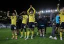 Oxford United players celebrate at full-time in midweek