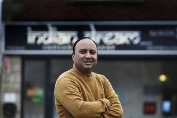 Herald Series: Hasnath Miah of the Indian Dream Takeaway in Didcot has suffered from cancellations of big orders for parties recently, but has not stopped helping those who need food with free curry throughout the pandemic.23/12/2021Picture by Ed Nix