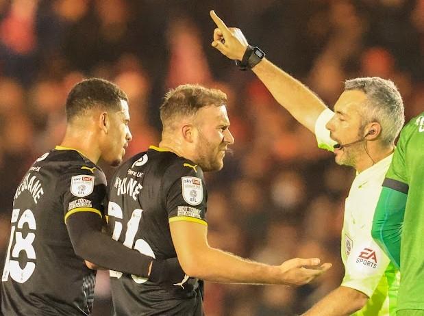 Herbie Kane is sent off by referee Seb Stockbridge at Lincoln City Picture: Steve Edmunds