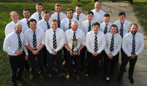 Herald Series: Players who represented Chinnor Falcons in the quarter-final and semi-final of the 2020 Oxfordshire Cup pose with the trophy at Kingsey Road Picture: Chinnor RFC Thame