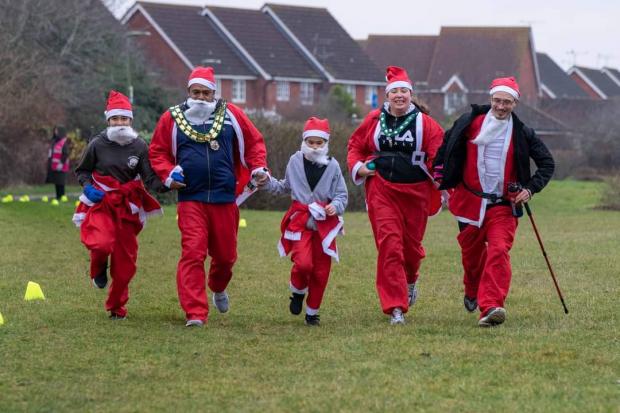 Herald Series: Mocky running as Santa