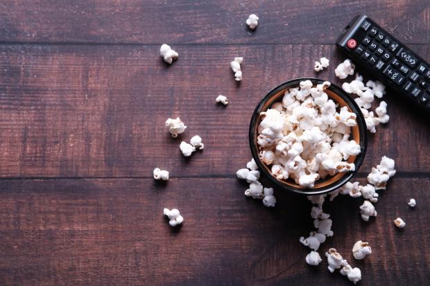 Herald Series: A bowl of popcorn and a TV remote (Canva)