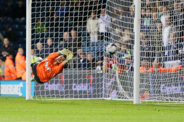Former Oxford United goalkeeper Max Crocombe in action during the penalty shootout against West Brom, in the Capital One Cup, in August 2014. Picture: Damian Halliwell