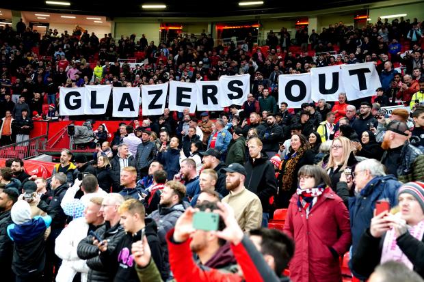 Manchester United fans protest against the Glazer family in the match against Chelsea on April 28