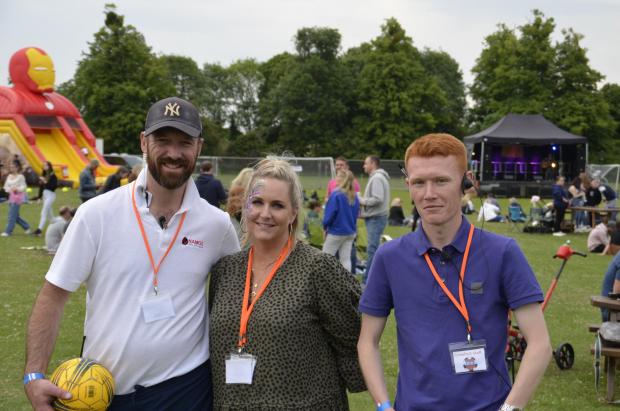 Herald Series: Football club chairman Richard Eltham with event organisers Laura Lynch and Jake Ramshaw (Picture: David Willerton)