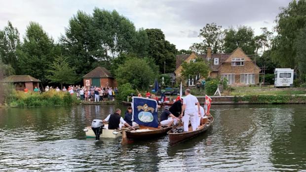 Herald Series: The Swan Upping crew passing the Wallingford Accessible Boat Club 