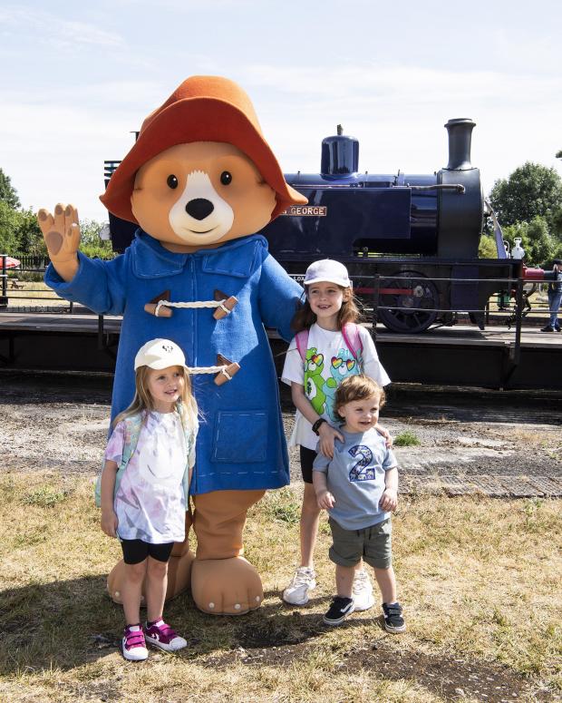 Herald Series: Paddington with some of his young admirers. The newly-restored locomotive ‘King George’ is on the turntable behind them. Picture by Frank Dumbleton