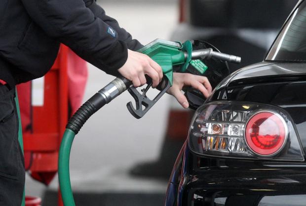 Herald Series: Someone using a fuel pump at a petrol station (PA)