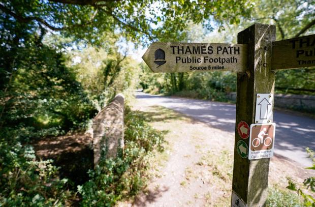 Herald Series: A view of a signpost for the Thames Path near to Somerford Keynes. Picture: Andrew Matthews/PA