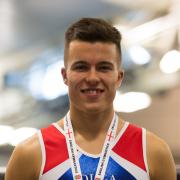 Ben Goodall proudly shows off his gold medal from the English Tumbling Championships