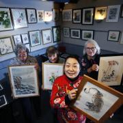 Art exhibition inside the Artyard Cafe in Enstone featuring Margaret White's work, a woman from Abingdon who set up the Tranquil Brush Group to paint Chinese style art.
L-R: Ann Applegate, Serena Marner, Jing Li and Jean Wykes.
Picture: Ed Nix.