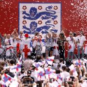 England’s Beth Mead lifts the trophy on stage during a fan celebration to commemorate England's historic UEFA Women's EURO 2022 triumph in Trafalgar Square, London.