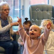 CARE: Baby group’s visits to care home help elderly lady recover from stroke. Picture by Elmbrook Care Home