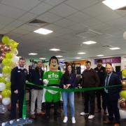 Cllr Maggie Filipova-Rivers opening the refurbished Didcot Wave gym with a ribbon cutting, with Cllr David Rouane, council staff, Better Man, and staff from Didcot Wave