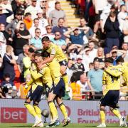 Oxford United's Josh Murphy (left) celebrates with teammates
