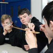 Joe Wright, Owen McDonagh and Lewis Froud from King Alfred's Academy, Wantage, build their own telescope at an outer-space themed school trip to Rutherford Appleton Laboratory, Harwell, on Monday, March 6, 2017.